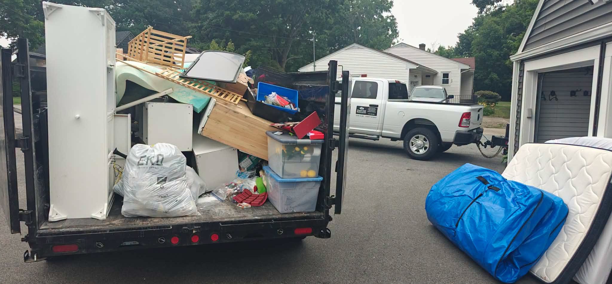 Rapid Junk Removal RI removing furniture and household junk from a Foster Rhode Island property